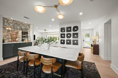 Gather around the spacious dining table for meals, games, and great conversation.