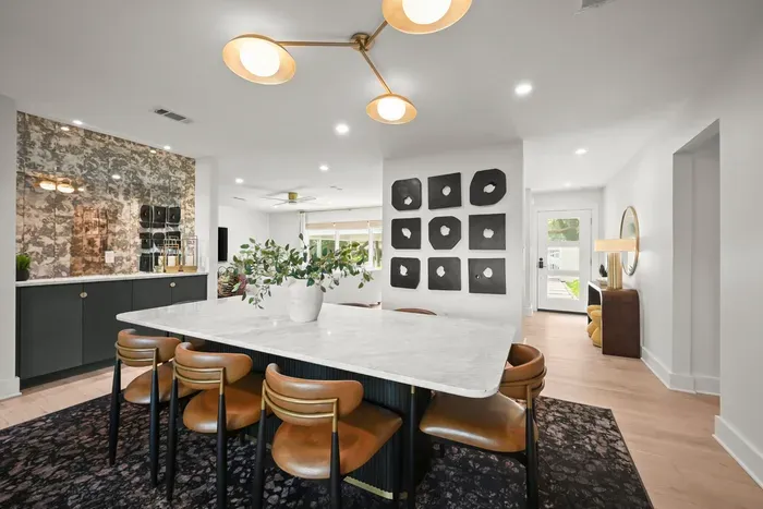 Gather around the spacious dining table for meals, games, and great conversation.