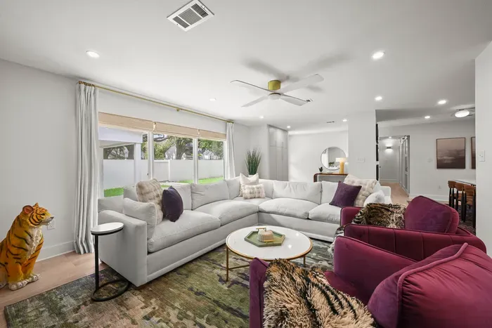 Relax in the spacious living room with comfortable seating and plenty of room for everyone to gather.