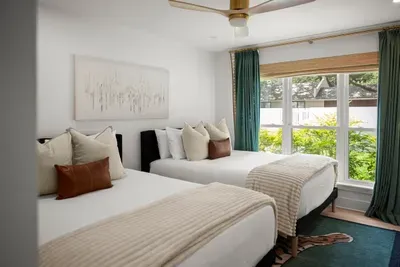 Comfortable accommodations with two cozy beds and thoughtful touches.