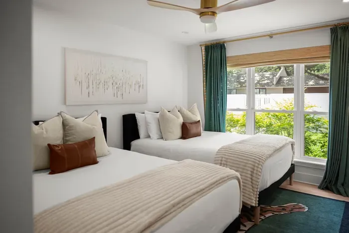 Comfortable accommodations with two cozy beds and thoughtful touches.