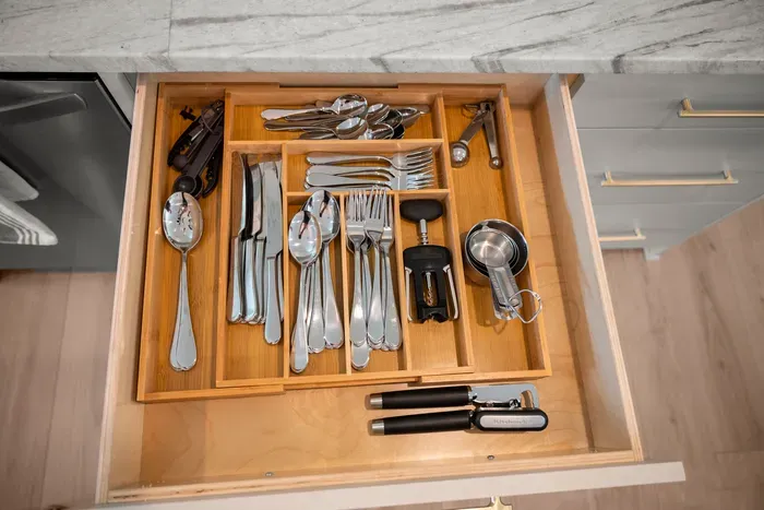 A complete set of silverware is neatly organized and ready for family meals throughout your stay.