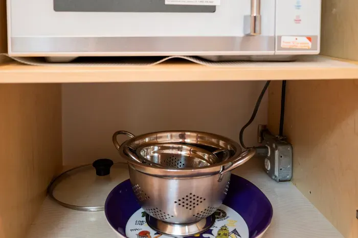 The fully equipped kitchen includes a microwave and quality cookware, making meal preparation quick and convenient throughout your stay.