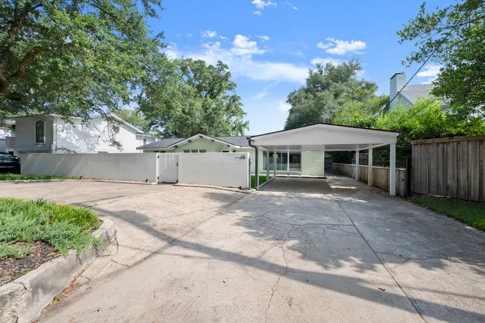 Welcome home! Enjoy a spacious driveway and covered parking, making arrivals and departures easy.
