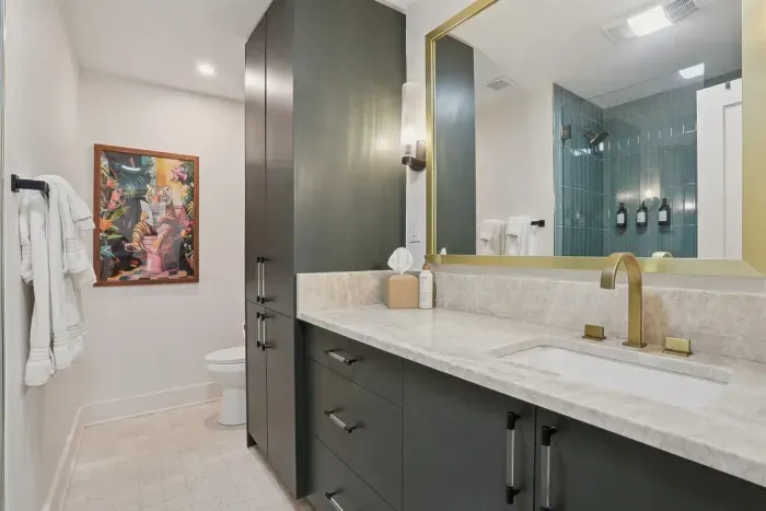 Modern elegance meets boutique hotel vibes  Featuring marble counters, gold accents, and a stunning walk-in shower.