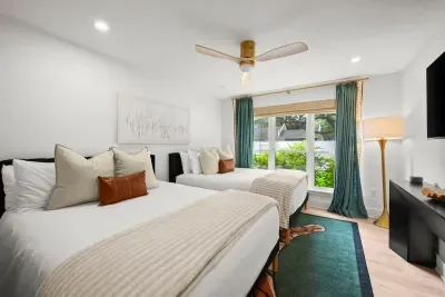 Spacious bedroom with two beds, perfect for family or friends.