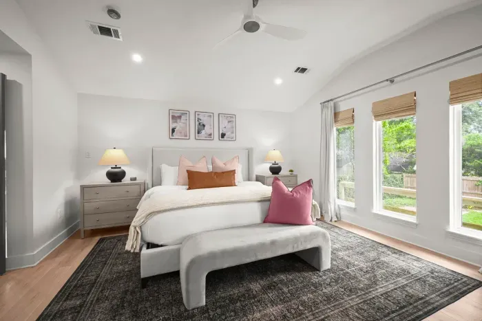 Spacious primary bedroom designed for a restful night's sleep.