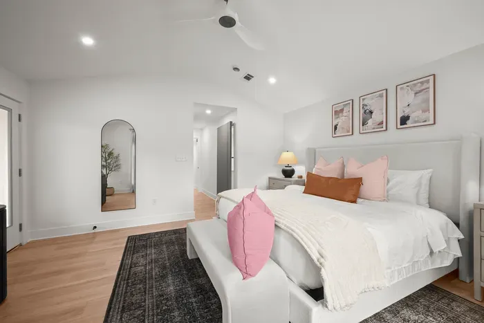 Another view of the spacious primary bedroom filled with natural light.