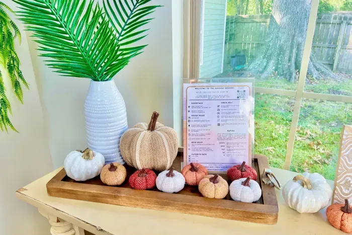 Bright pumpkins and rich fall colors bring a cheerful seasonal feel to the home.