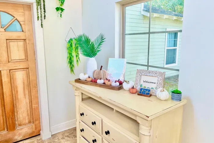 Colorful pumpkins and warm autumn accents create the perfect inviting atmosphere for a fall getaway.