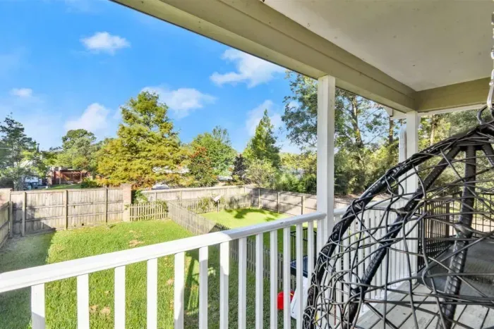 Relax in your hammock chair overlooking the lush gated back yard.