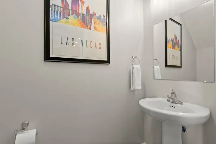 Step into this small, yet impeccably clean bathroom, offering a refreshing oasis of tranquility and cleanliness