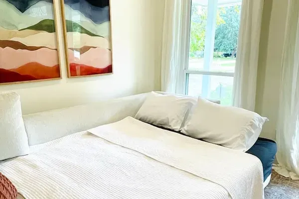 Sofa bed linens and pillows located in the hall closet.