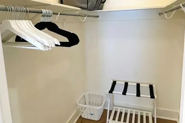 All bedroom closets are stocked with the following:

•  wooden and velvet hangers
•  luggage rack 
•  laundry basket 
•  extra pillow and blankets