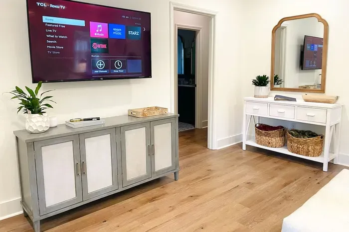 55" TCL Roku TV located in living room.  Bring your own login to enjoy countless streaming options such as Netfix, Hulu, Amazon music and more.