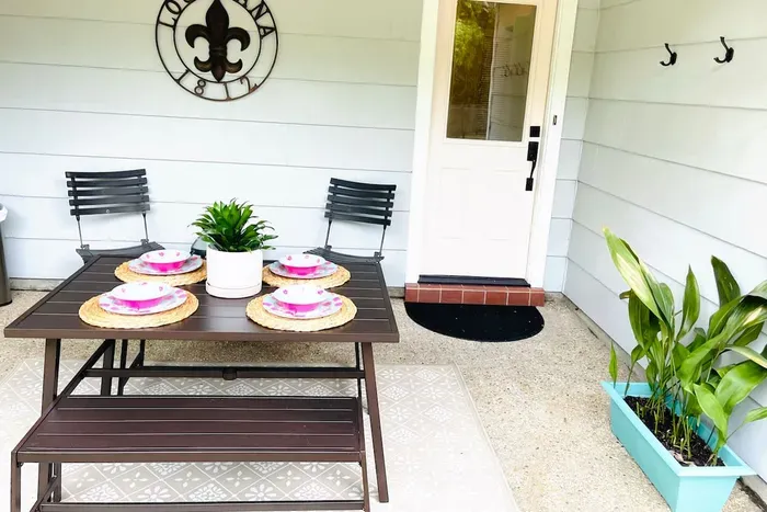 Relax on the private, gated back patio and enjoy al fresco dining.  

Outdoor dishes located in the kitchen cabinet above the coffee maker.
