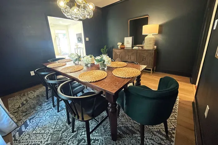 Large farm table with seating for 8.  

Perfect for family meals or gather around for game night.   

All lights are on a dimmer to create the perfect ambiance.