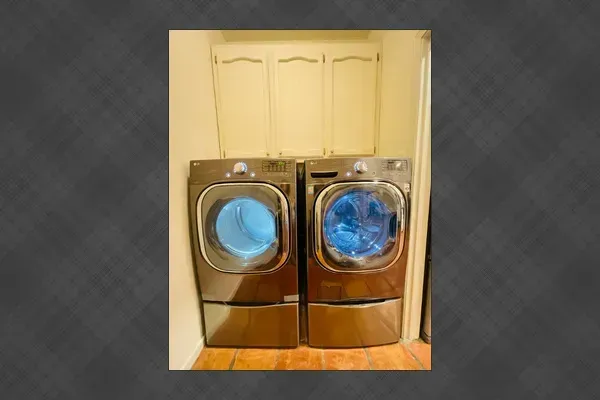 The laundry room provides added convenience with a washer and dryer available for your use. Pack lighter and enjoy the comfort of having laundry facilities right at home.