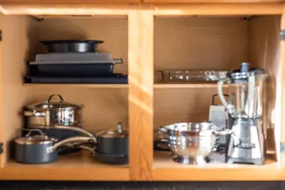 Embark on culinary adventures in this well-equipped kitchen, boasting essentials and ample storage.