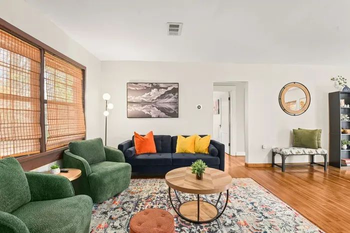 Unwind in the living room of this home, thoughtfully equipped with all the essentials for relaxation and entertainment