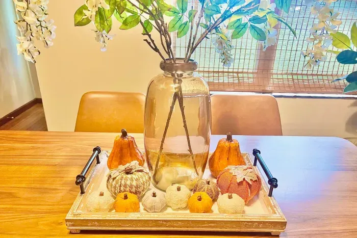 Vibrant pumpkins create an inviting autumn atmosphere perfect for a cozy getaway.