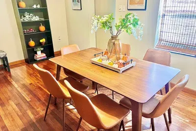 A cheerful pumpkin display creates a cozy setting for autumn meals and gatherings.