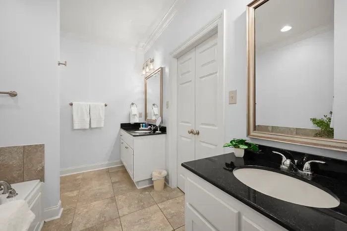 A clean, well-appointed bathroom with plenty of room to get ready comfortably.