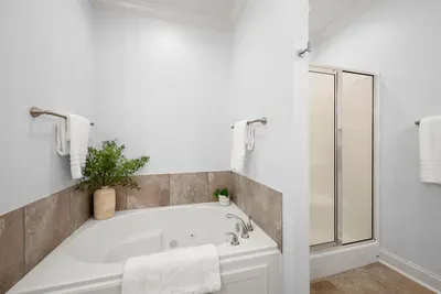 Unwind in the spacious soaking tub or refresh in the separate walk-in shower.