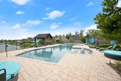 Enjoy a refreshing day by the community pool, surrounded by beautiful views and plenty of space to relax.