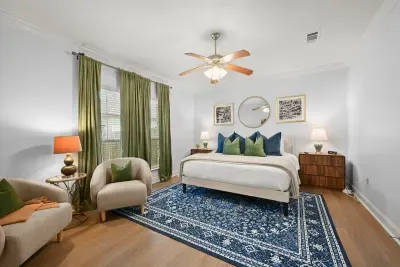 Relax in comfort with a cozy seating area, beautiful natural light, and modern touches