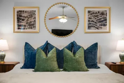 Elegant bedroom details with plush pillows, stylish artwork, and a cozy, inviting atmosphere.