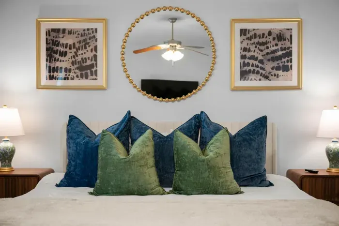 Elegant bedroom details with plush pillows, stylish artwork, and a cozy, inviting atmosphere.