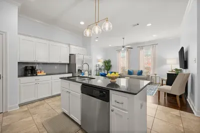Prepare meals with ease in this beautifully appointed kitchen featuring modern appliances and plenty of workspace.