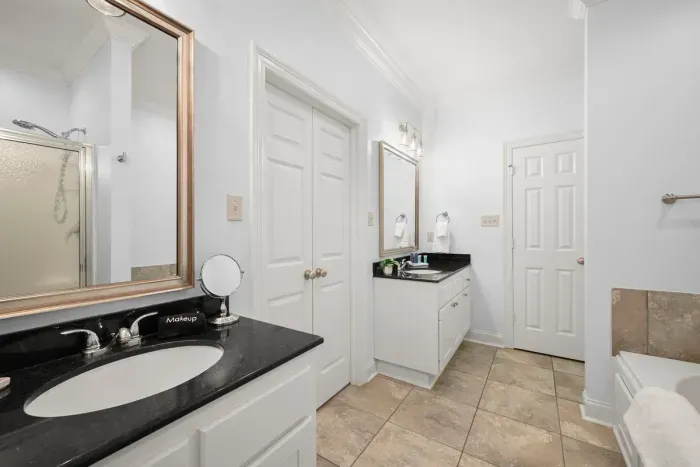 A well-appointed bathroom with a spacious vanity and plenty of room to get ready comfortably.
