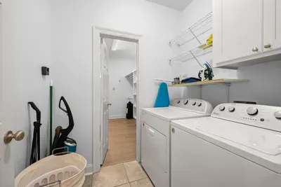 Convenient in-home laundry area with a washer, dryer, and everything you need for your stay.