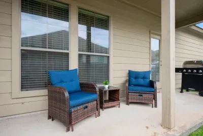 Step outside and settle into the cozy patio seating, perfect for relaxing with family or friends.