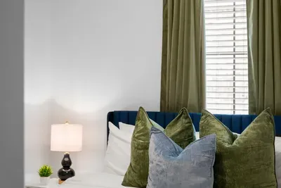 Settle in and relax with cozy bedding and thoughtful touches throughout the room.
