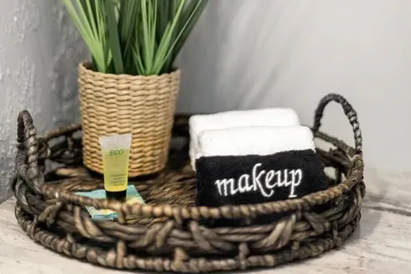 Hotel style shampoo, conditioner, bar soap and body lotion make-up towels.