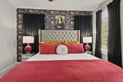 Unveil your artistic side in our designer home adorned with a Monalisa portrait, while snuggling up with a cozy pink blanket that adds a touch of warmth and style