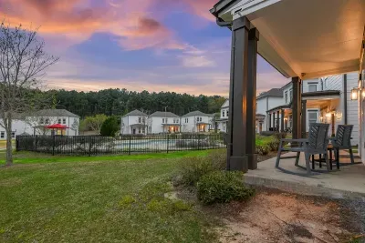 Snuggle into the beauty of nature with your captivating front porch view overlooking the pool, creating an inviting environment that invites you to relax and unwind in this picturesque setting