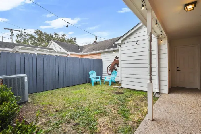 Fenced in back yard leading to private garage.