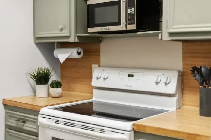 4 burner electric stove and microwave.