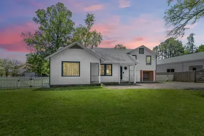 Welcome to the sprawling Bamboo Estate, a gated 1 acre mid century modern themed property in the center of town.