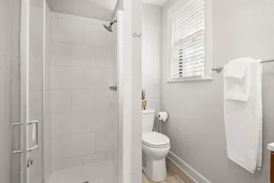 Private full bathroom with updated shower for the upstairs suite.