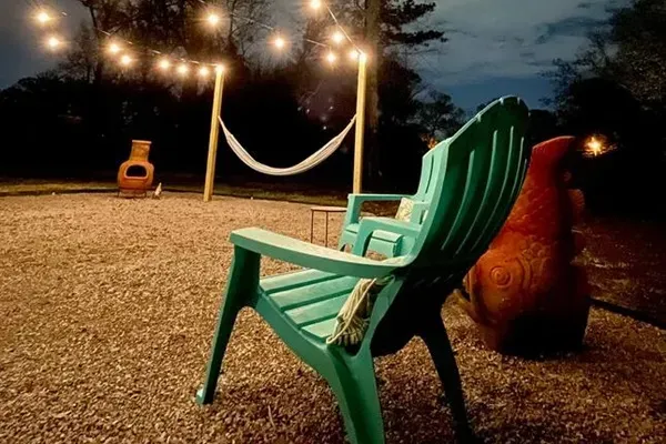 Outdoor Retreat: Twinkling lights and comfy seating create the perfect stargazing escape!