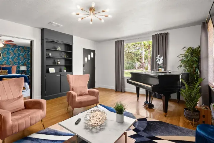 Capture the inviting essence of this home with a view from the living room to the front door, showcasing seamless design and warm hospitality right from the entrance.