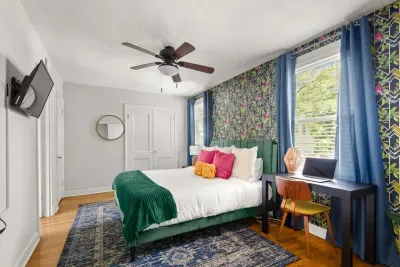 Escape to the tranquility of the second-floor 3rd bedroom, featuring a soothing green palette and creating an ideal space for productivity and relaxation alike.