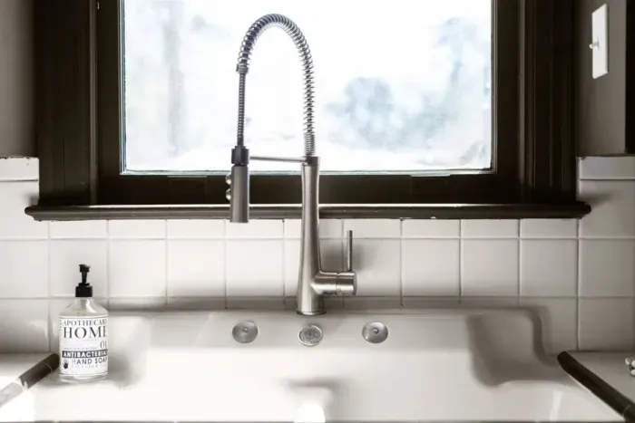Farm style sink with fantastic natural lighting.