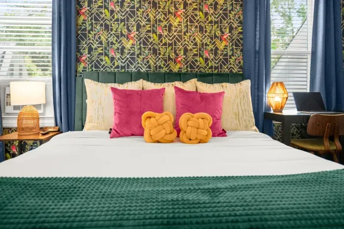 Experience the complete charm of the third bedroom in a single glance, where every detail comes together to create a serene and inviting sanctuary for rest and relaxation.