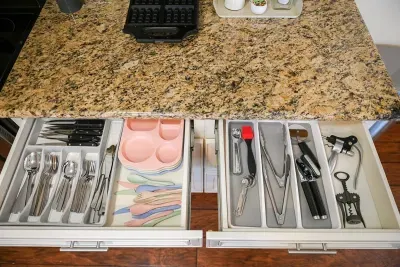 All set for cooking: Spoon, forks, and essential utensils neatly organized in the kitchen drawer